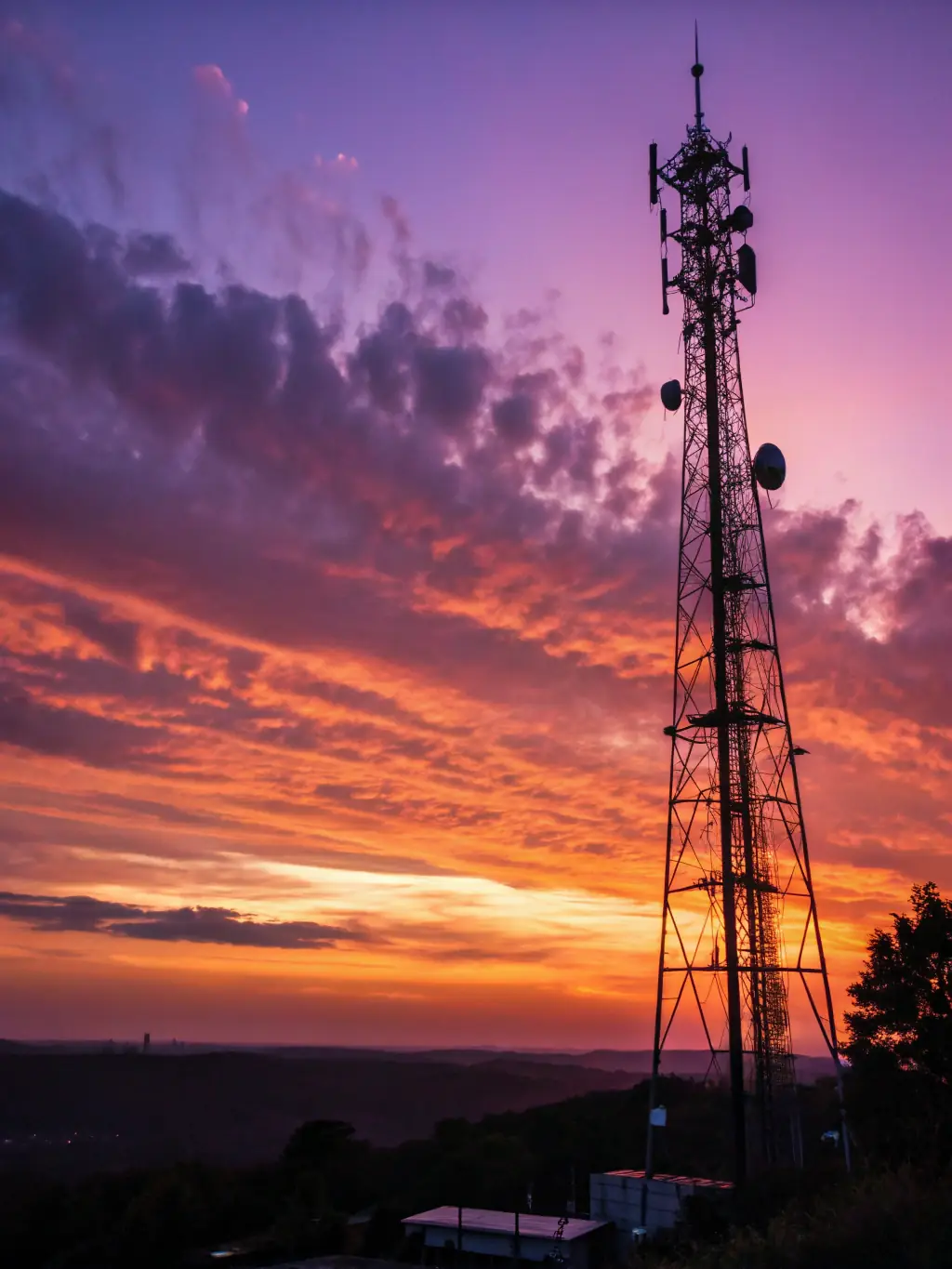 A high-tech telecommunications tower emitting radio waves, symbolizing Smartrfsolutions' contribution to the telecom industry.